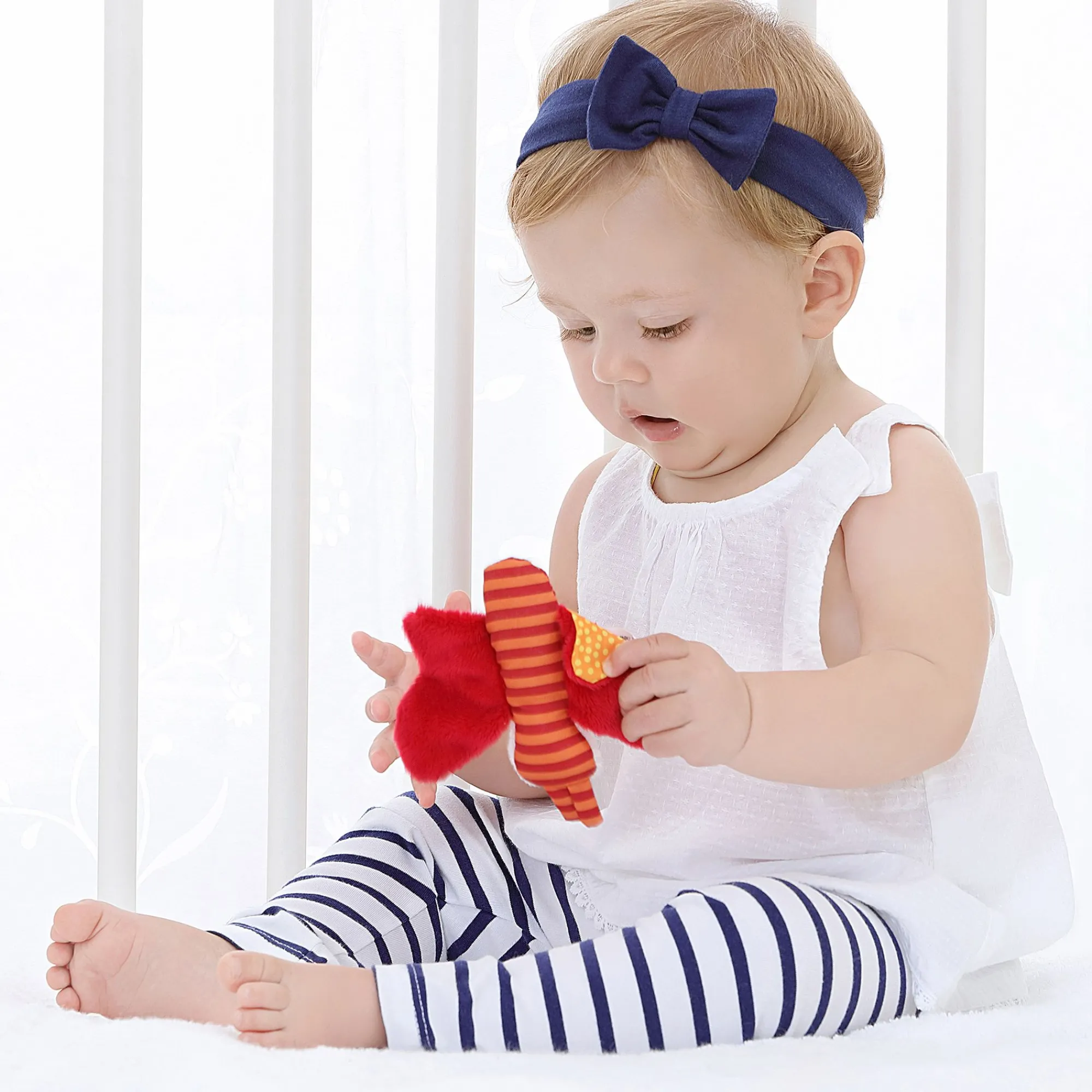 Sigikid Babyspielzeug|Schmetterling Orange, Red Stars